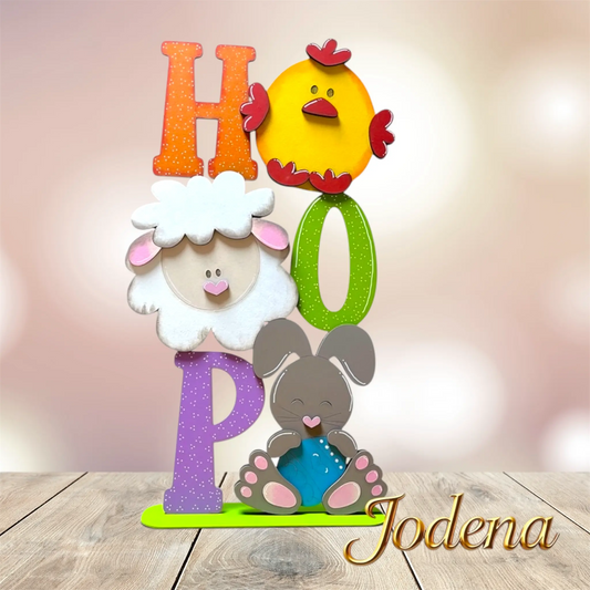 Osterschild-HOP-auf-Tisch-rosa-Bokeh