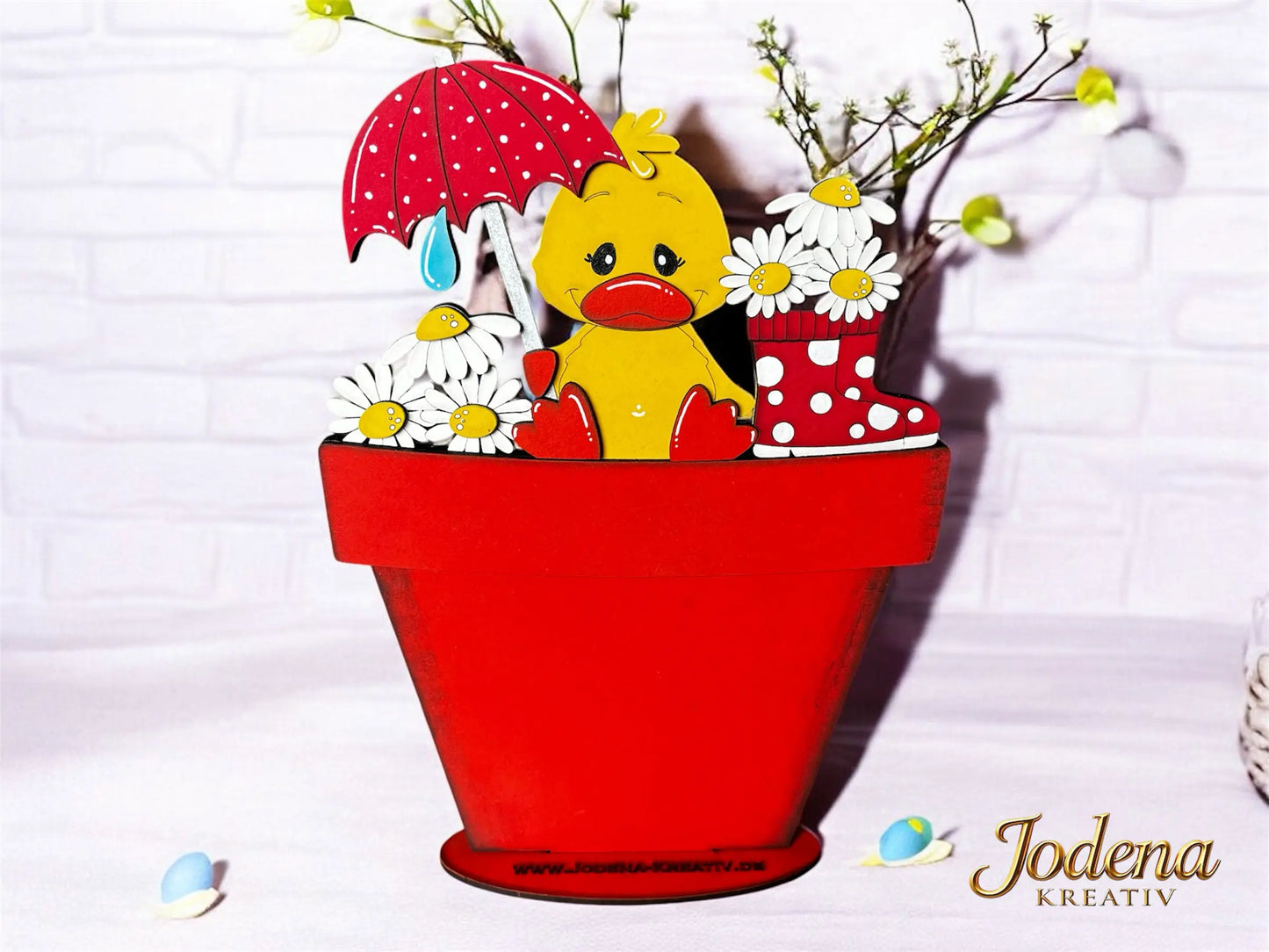 Motiveinsatz_Fruehlingsente_Blumentopf_hellgeschmueckt