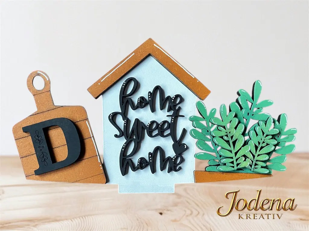Motiveinsatz_HomeSweetHome_solo_mitBuchstabe_aufHolztisch