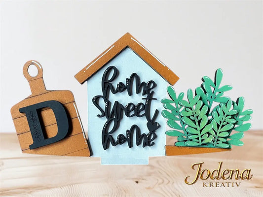 Motiveinsatz_HomeSweetHome_solo_mitBuchstabe_aufHolztisch