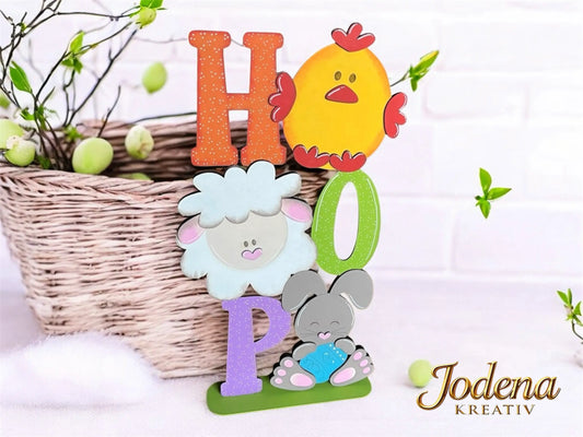 Osterschild-HOP-weisse-Steinmauer-geschmueckt