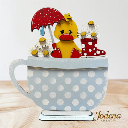 Teetasse_BasisForm_mit_Korbeinsatz_Ente_auf_Holztisch