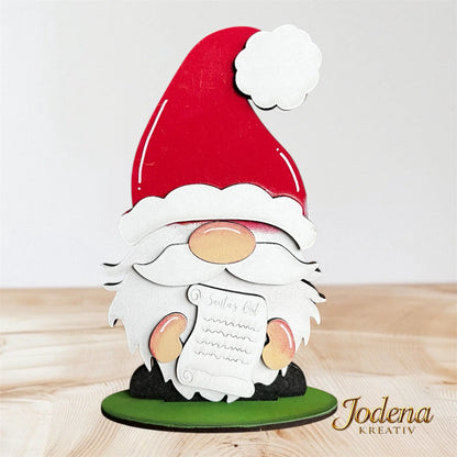 Weihnachtswichtel_Weihnachtsmann_mit_Wunschzettel_auf_Holztisch