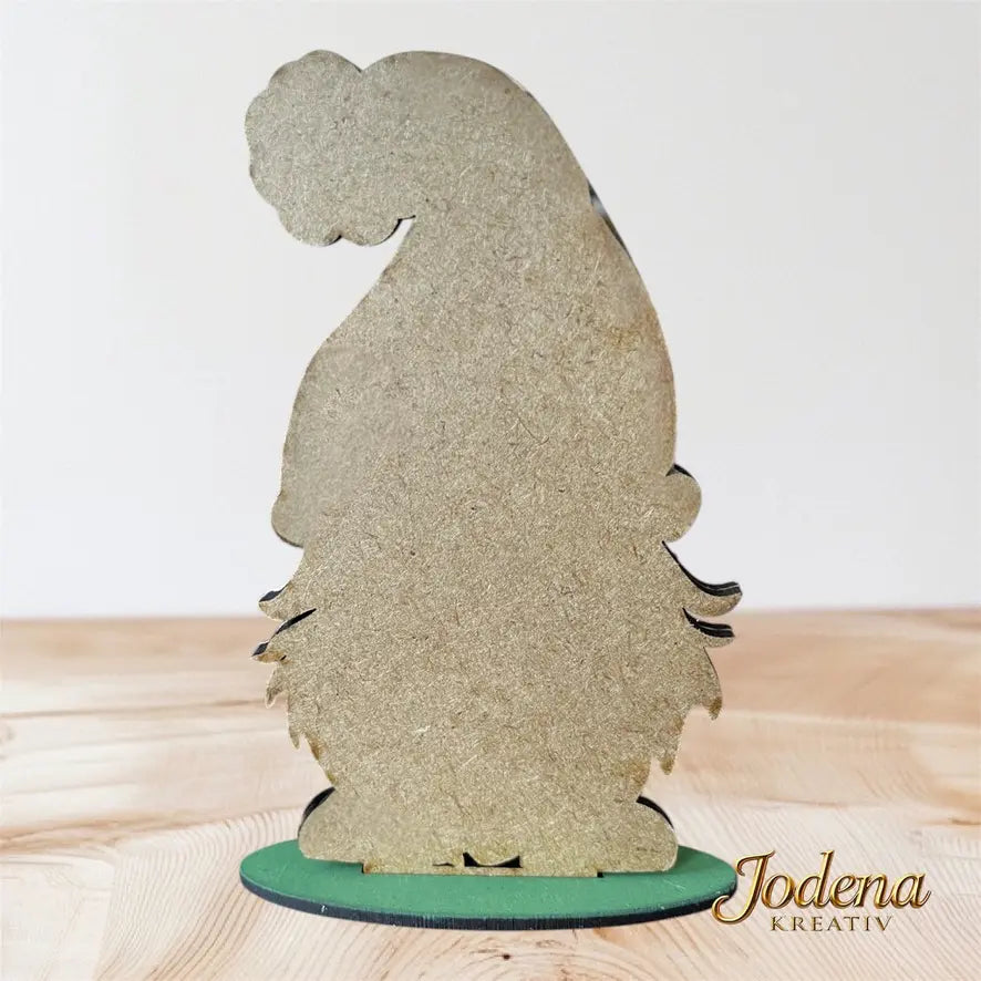 Weihnachtswichtel_mit_Wunschzettel_auf_Holztisch_Rueckseite